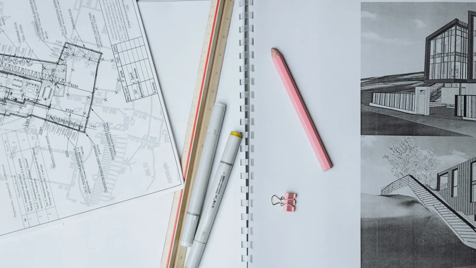 Technical drawings, elevations and marker pens on a desk