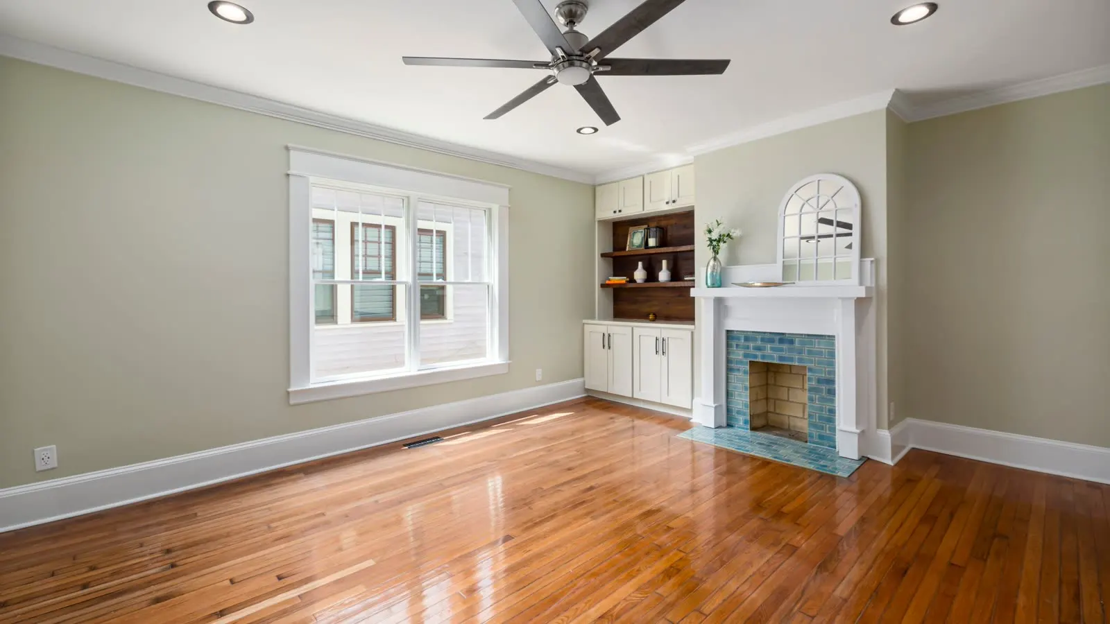 A finished room with hardwood flooring, ready to hand back
